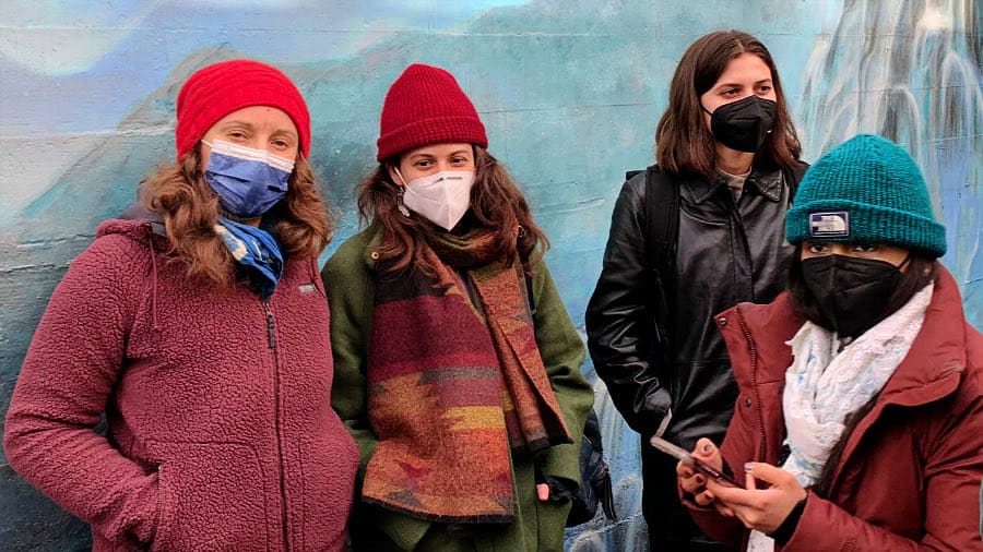 Four Women Standing Outside Wearing Masks